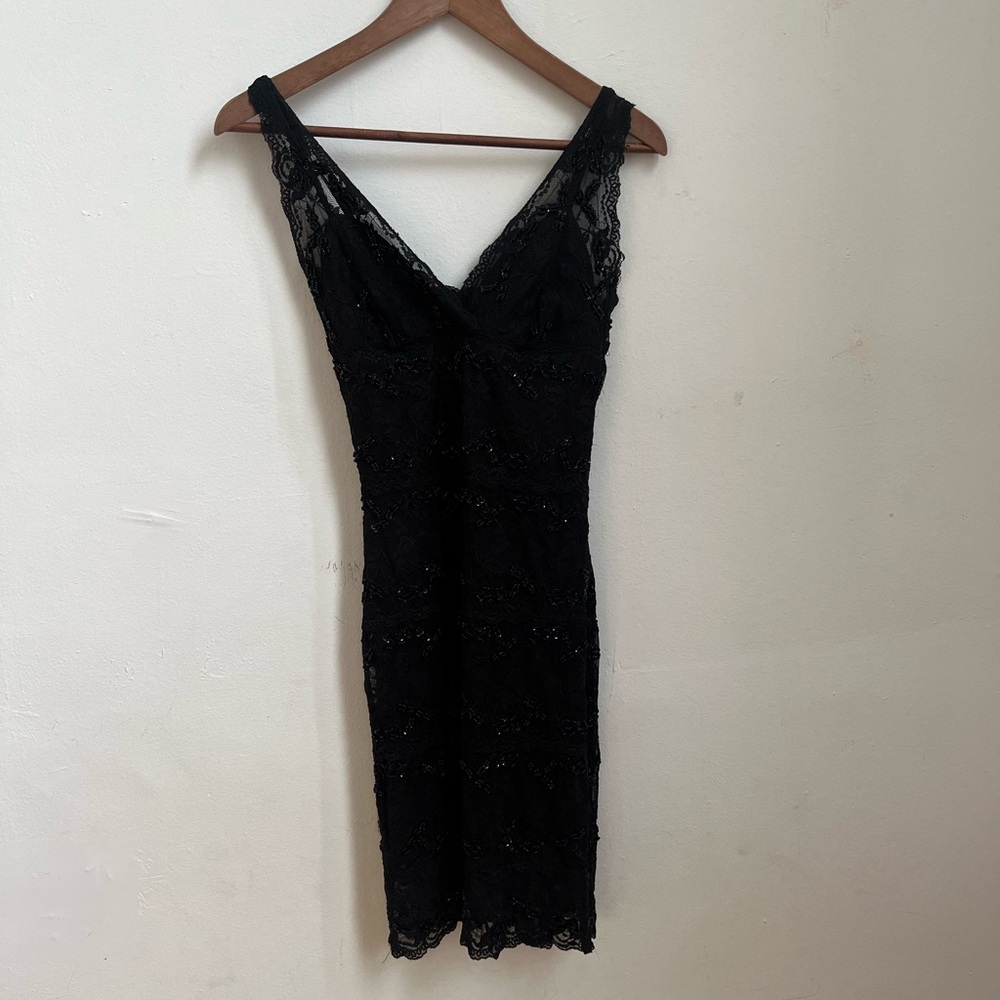 Vintage black lace fitted mini dress from Le Chateau with beaded details. XXS